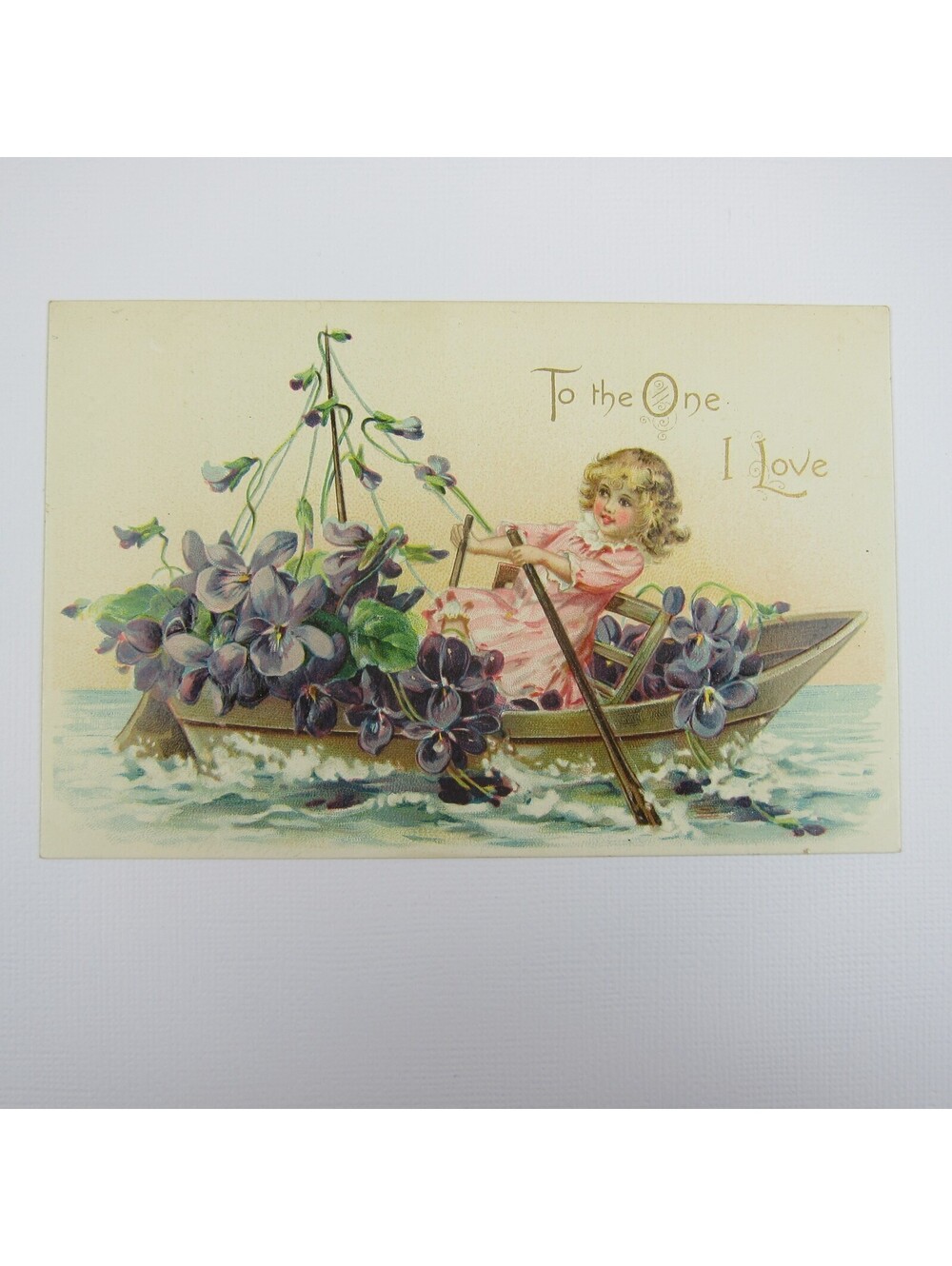 Tuck Postcard Greeting Valentine Girl Row Boat Purple Flowers Embossed UNPOSTED